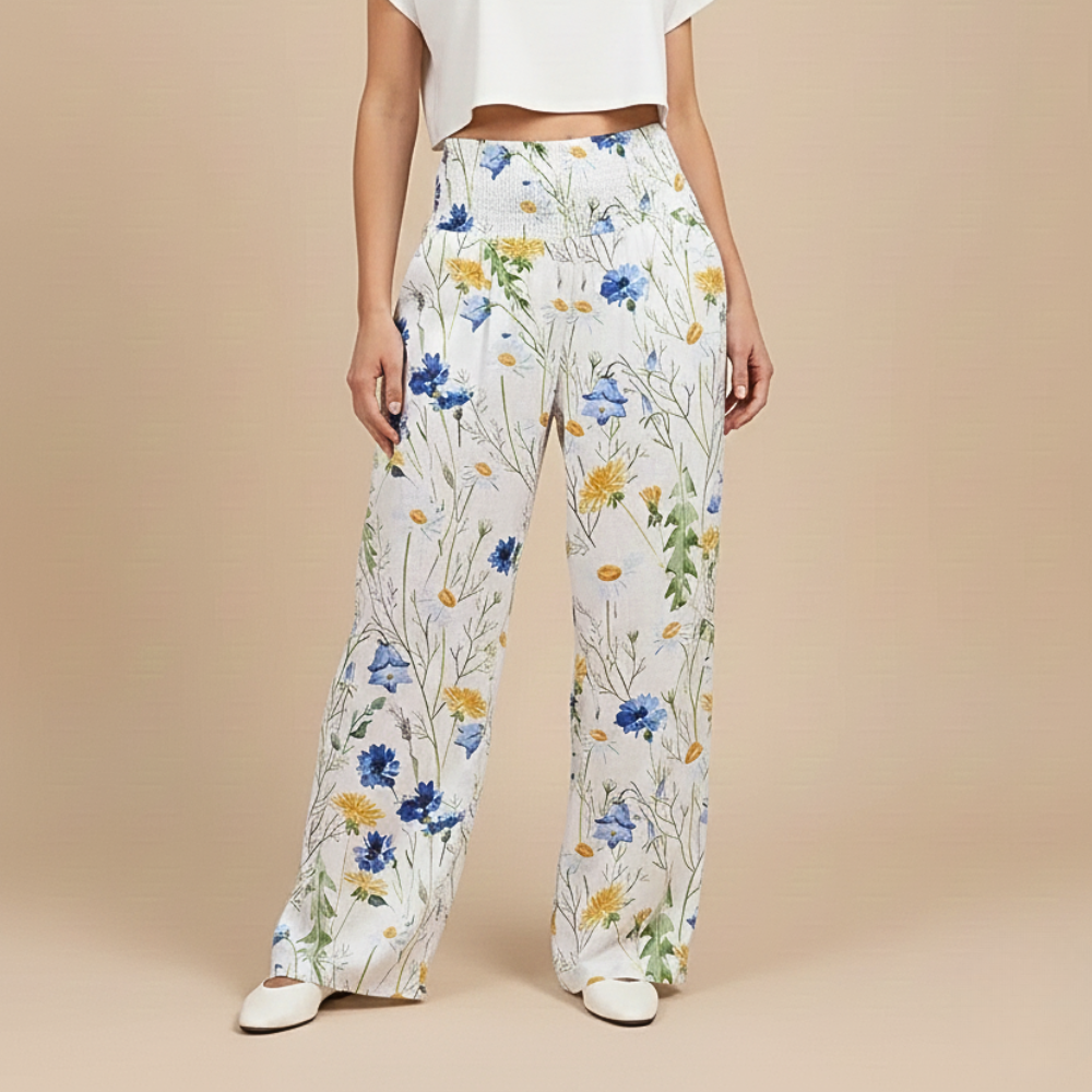 Damesbroek met wijde pijpen en bladprint hoge elastische taille Jelle Jora Mode